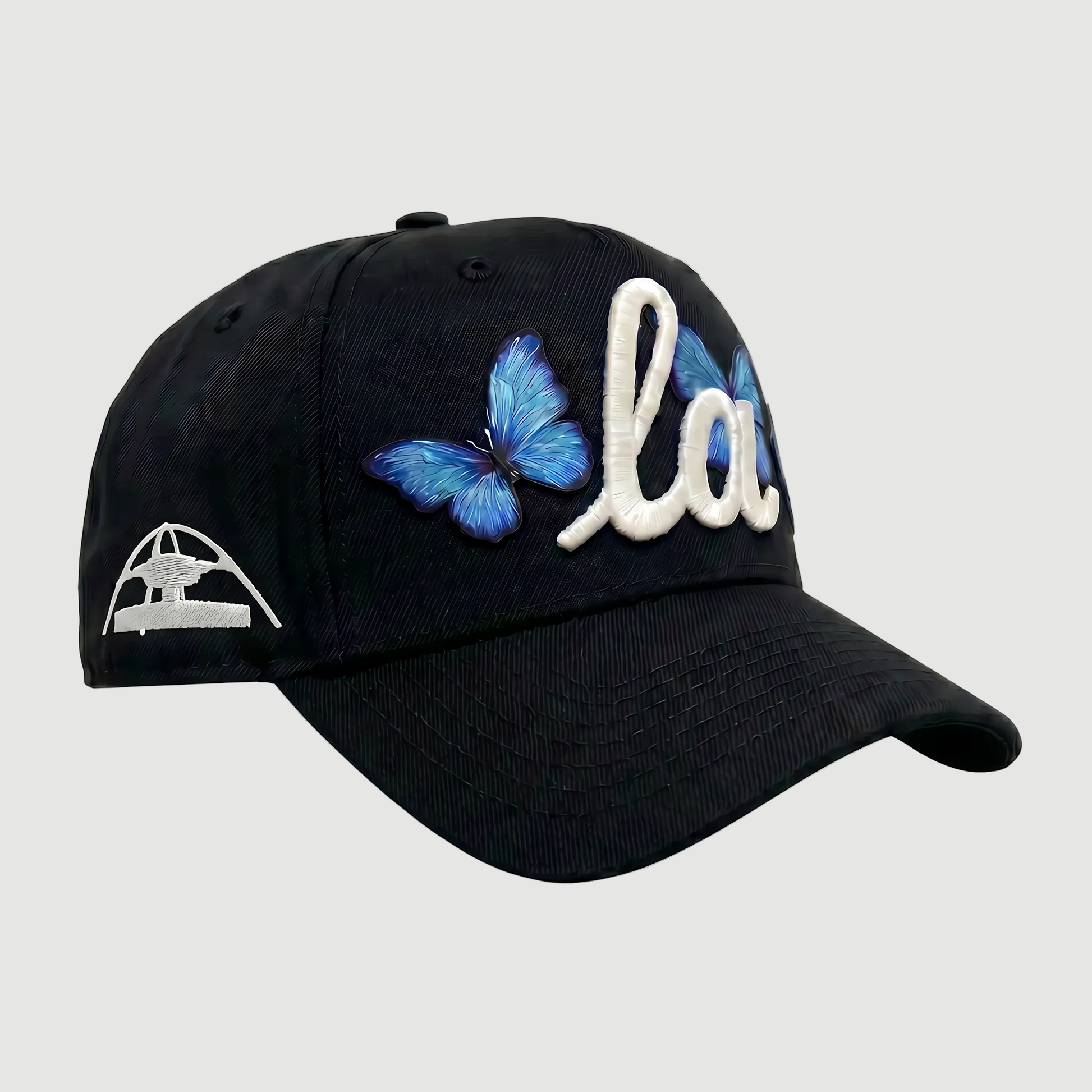 Black cap with blue butterfly and white text on a white background